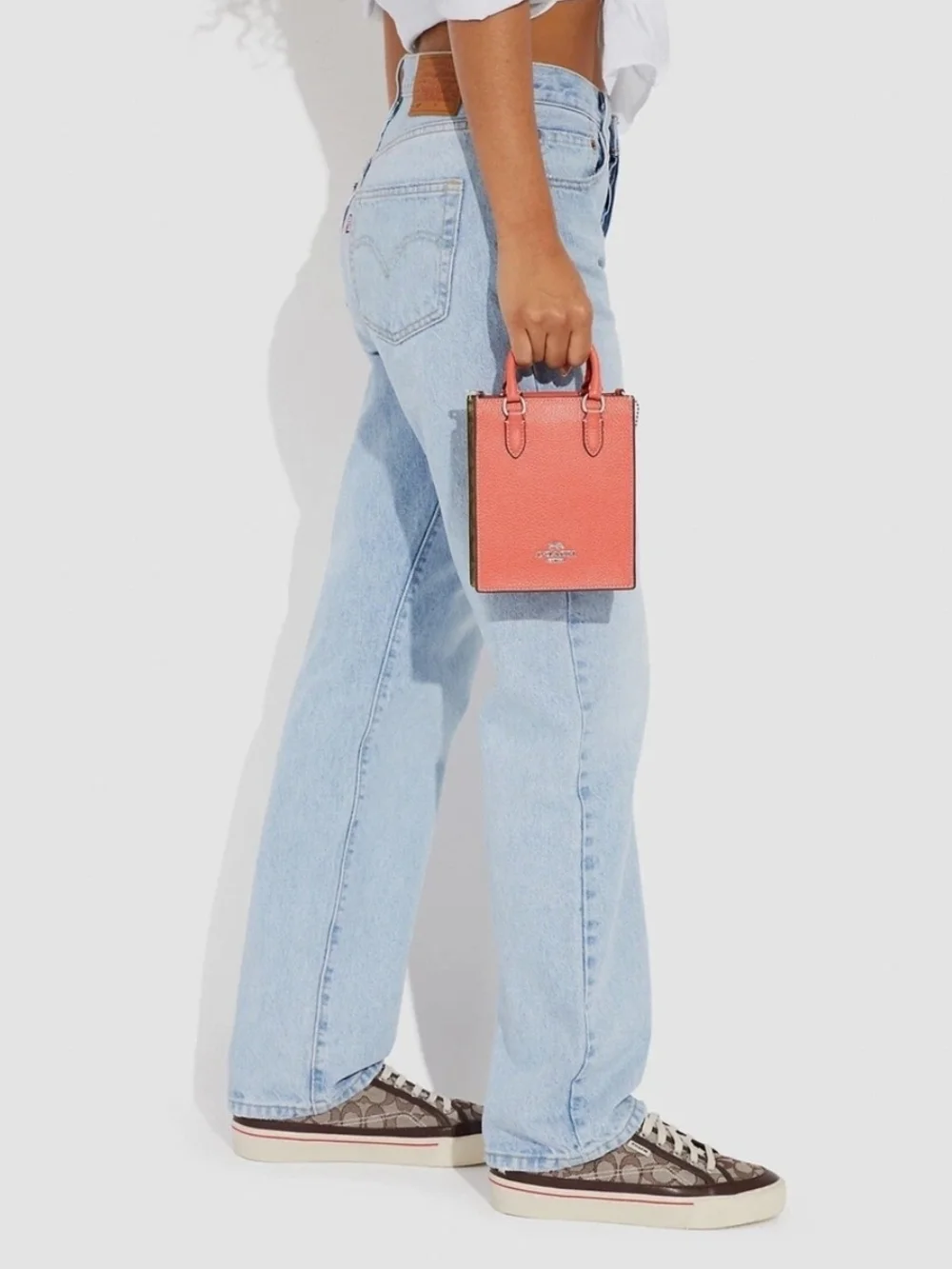 Coach Pebbled Leather Crossbody Phone Bag in Coral with Signature Strap